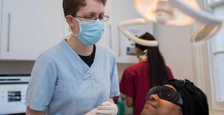 dentist about to operate on a patient, NHS dentist, dentistry, dental appointment